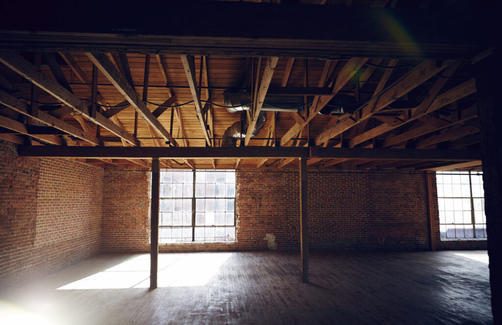 Wood beams and brick walls in empty loft space